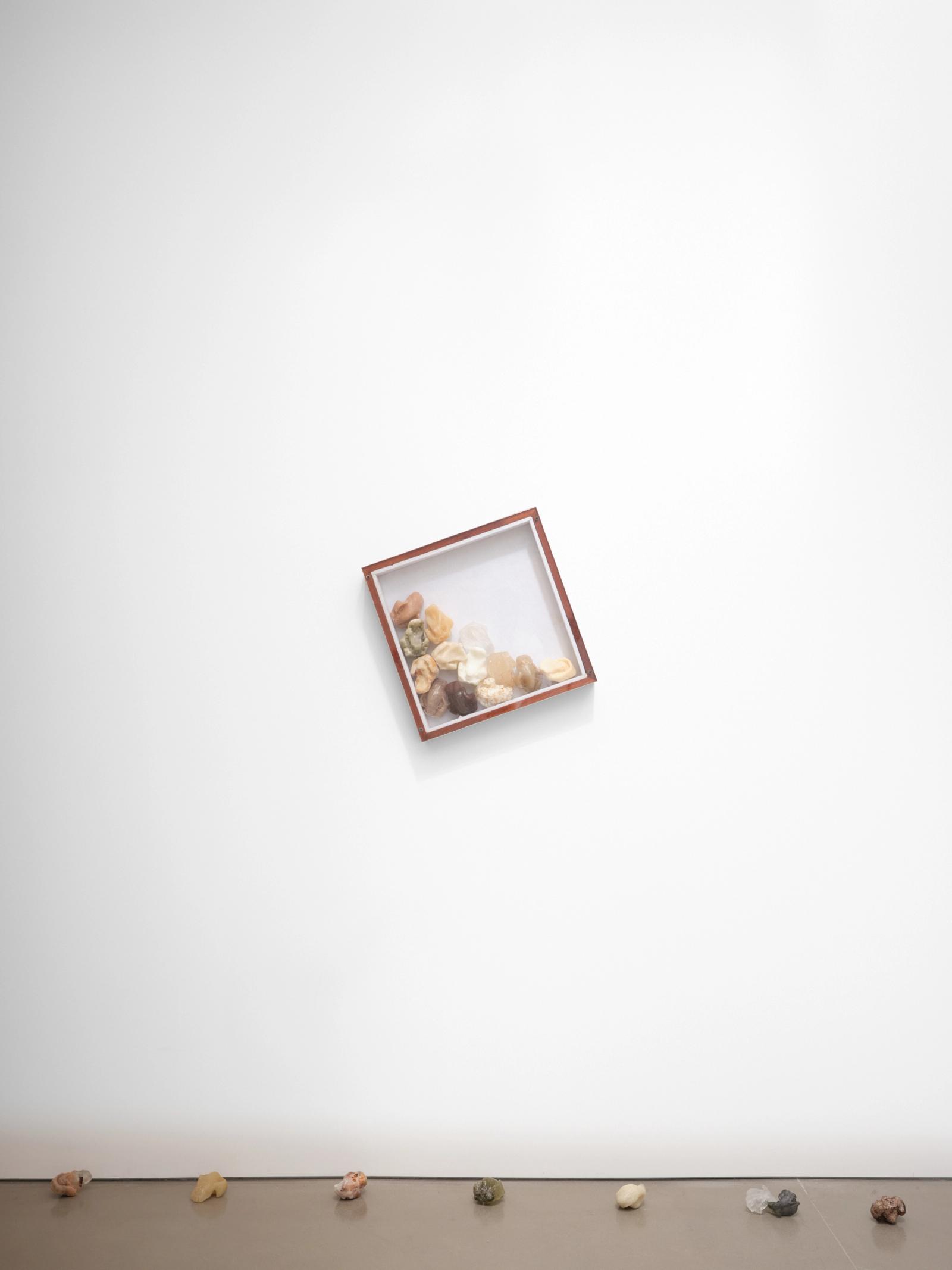 Jeenho Seo, depends, 2022. Rice, assorted packaged food and beverages, polyurethane, Poly-Optic, polyester, wood, plexiglass, ball-bearing swivel,
19 × 19 × 3.5 in. Photo: Charlie Rubin